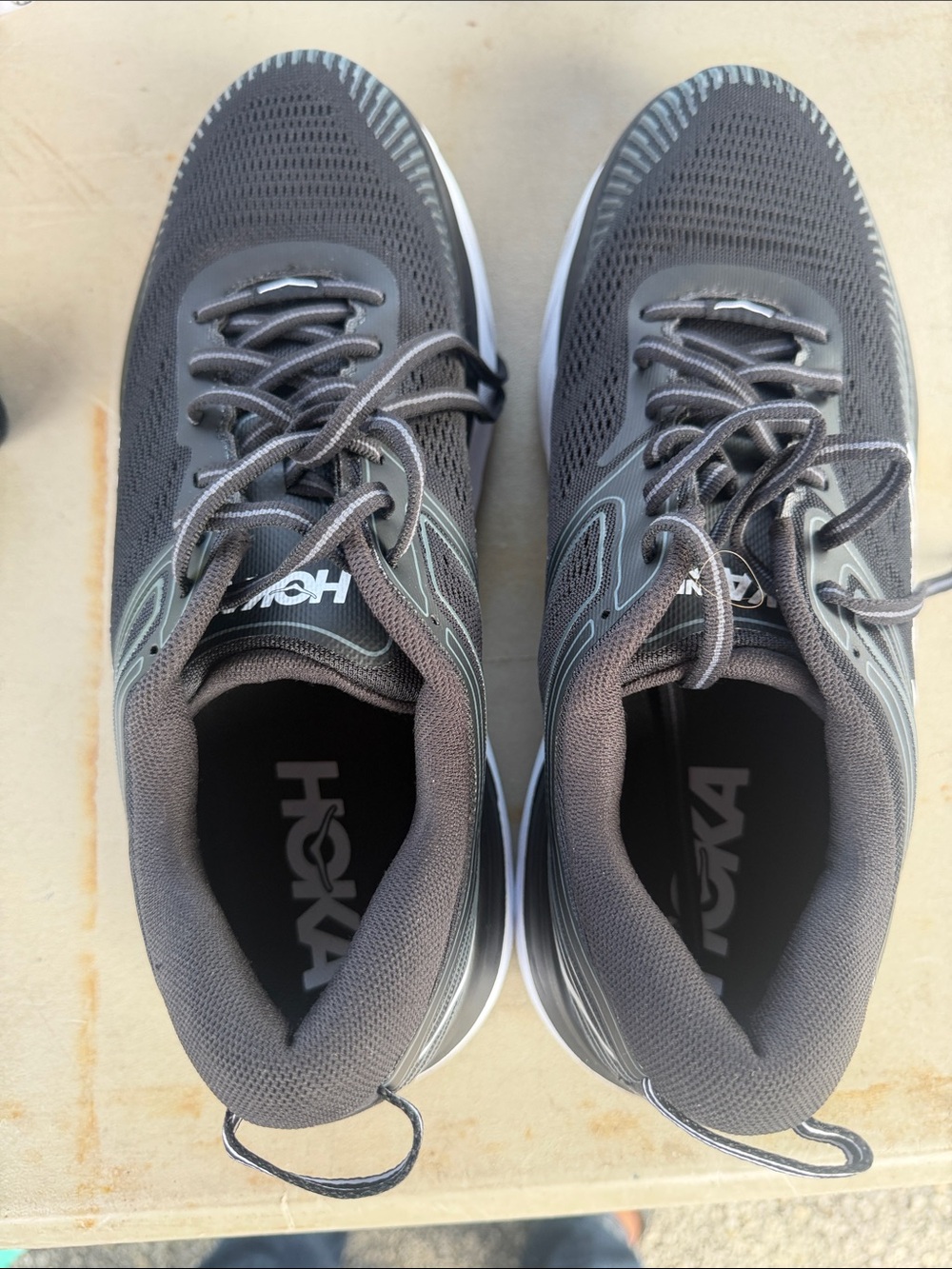 Make your offer. Hoka Dark Gray Athletic Running Shoes with Silver Detailing